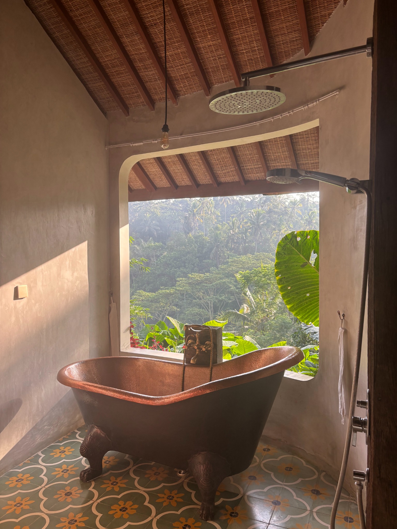 Freestanding bathtub and rain shower overlooking the jungle at Harmony Hill Bali