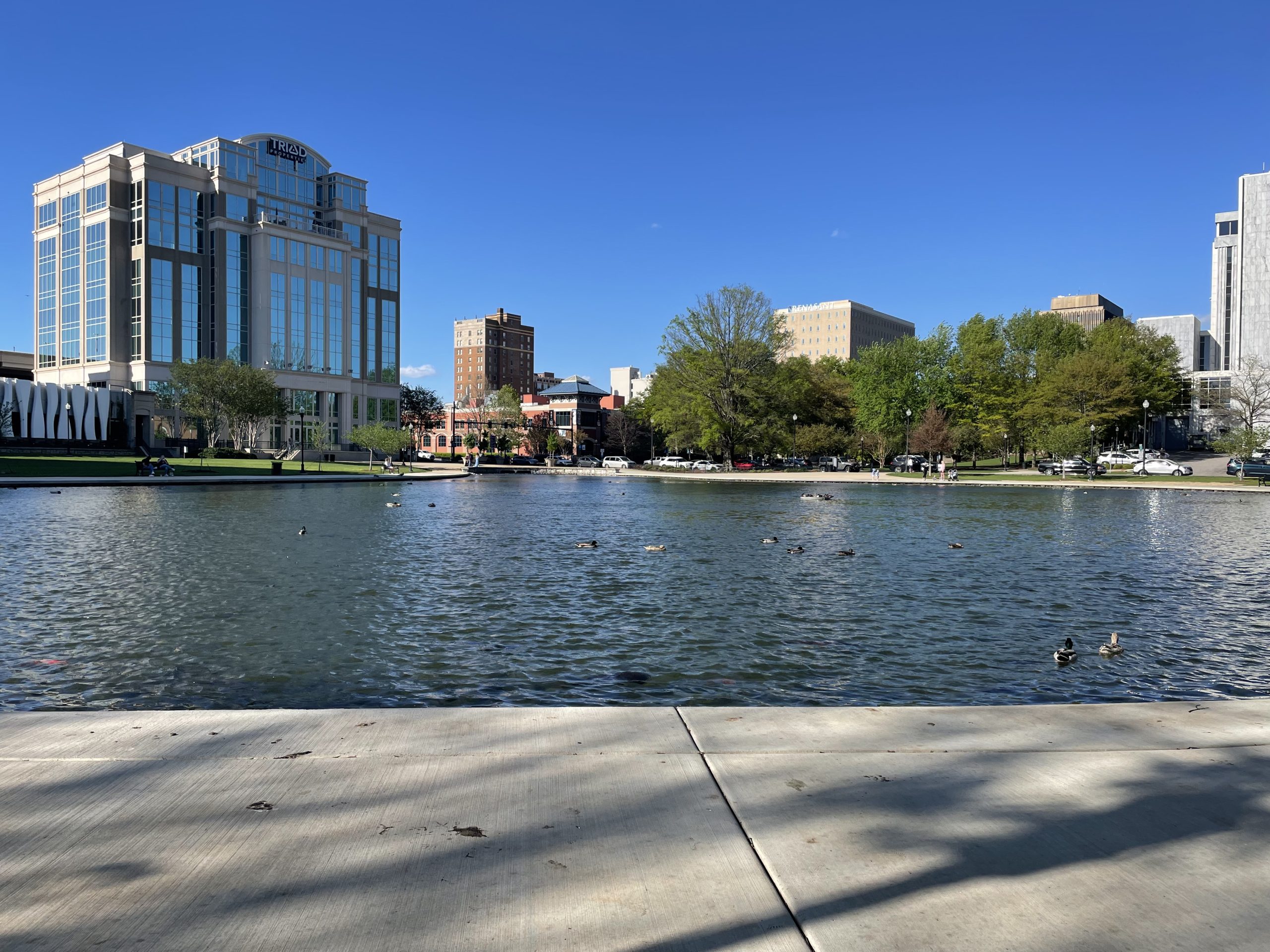 Big Spring Park lake and downtown buildings in Huntsville, Alabama