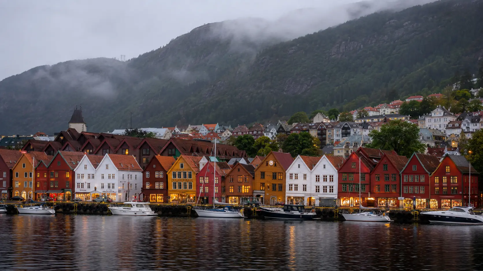 Bergen harbour and Bryggen beneath misty mountains