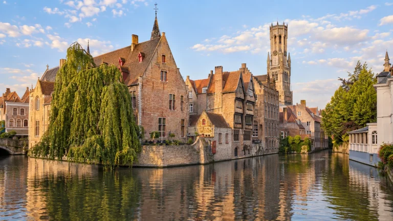 Illustrative Bruges canal scene with historic brick houses and the Belfry