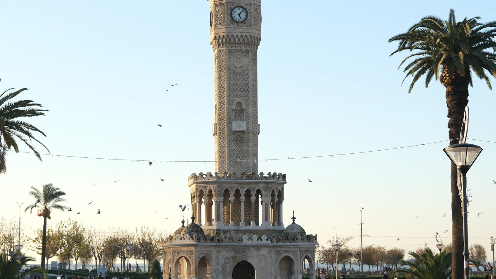 İzmir Clock Tower in Konak Square with palm trees