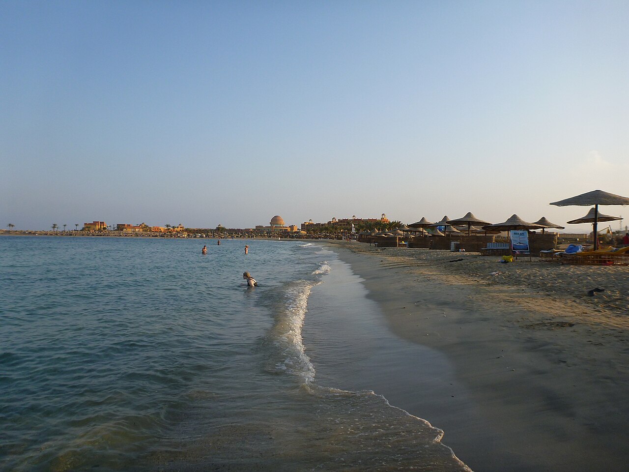 Sandy shoreline and beach parasols at Marsa Murena in the Marsa Alam region