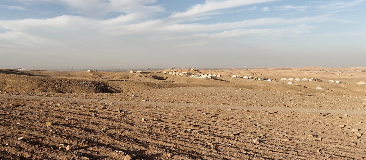 Rocky Agafay desert scenery with distant camps